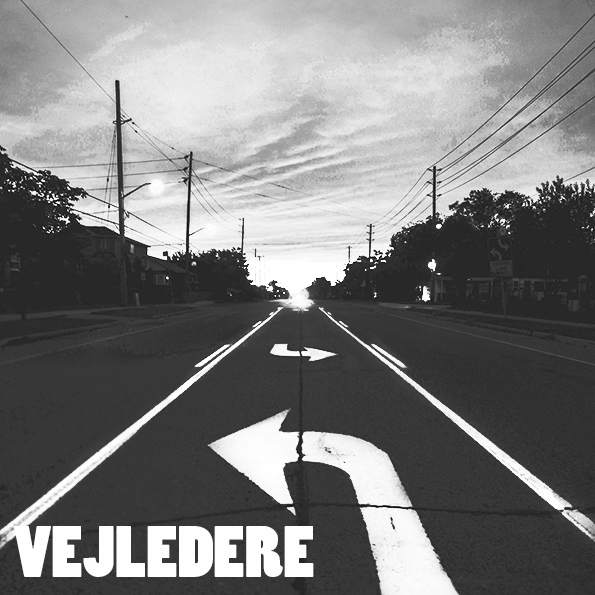 UU Vejledere. Billedet viser en vej med malede pile, påført teksten vejledere..